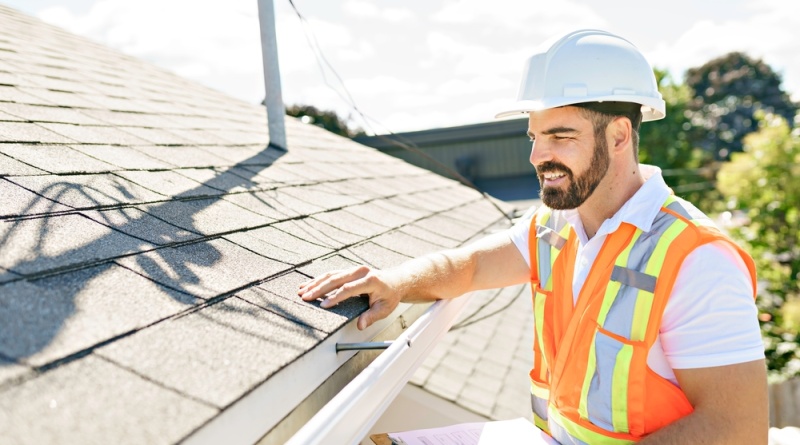 Man Inspecting the Roof